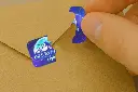 Hologramas_28x20_SEGURIDAD_Tinta_PLATA_USO_3.webp